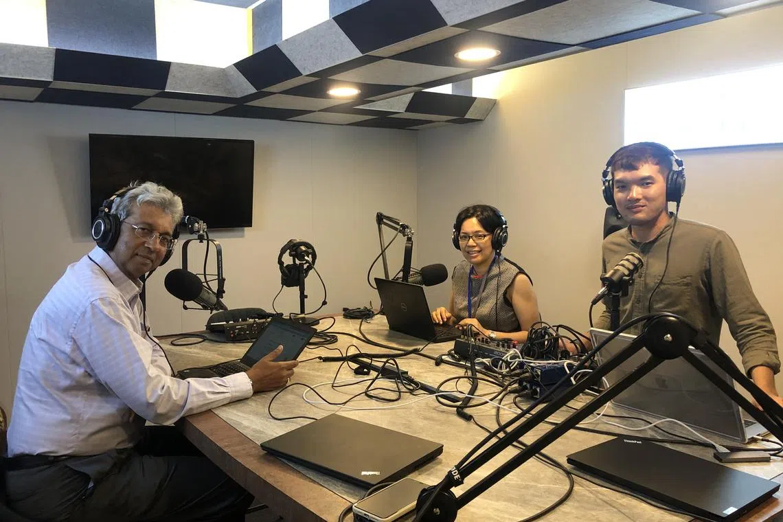 (From left to right) The Straits Times associate editors Ven Sreenivasan and Lee Su Shyan in the podcast studio with podcast producer Teo Tong Kai to record an episode for Invest Talk.