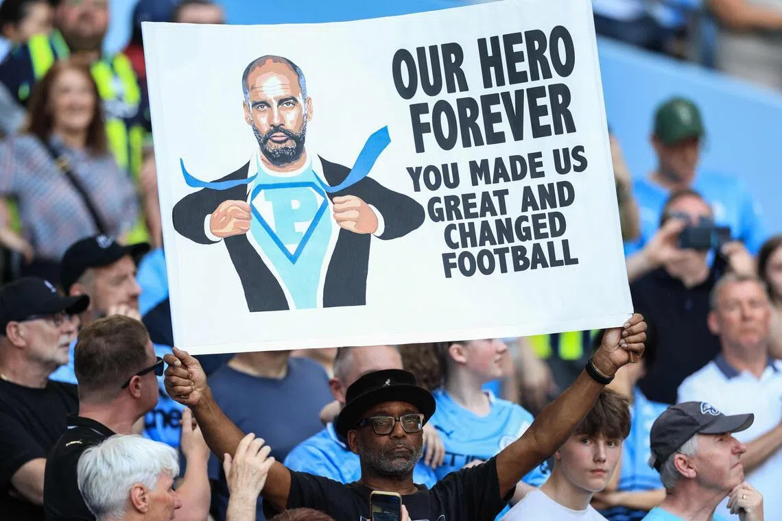 A supporter holds up a sign in honour of Manchester City's Spanish manager Pep Guardiola during ceremonies to honour those leaving the club, including Guardiola, at the end of the season. 
