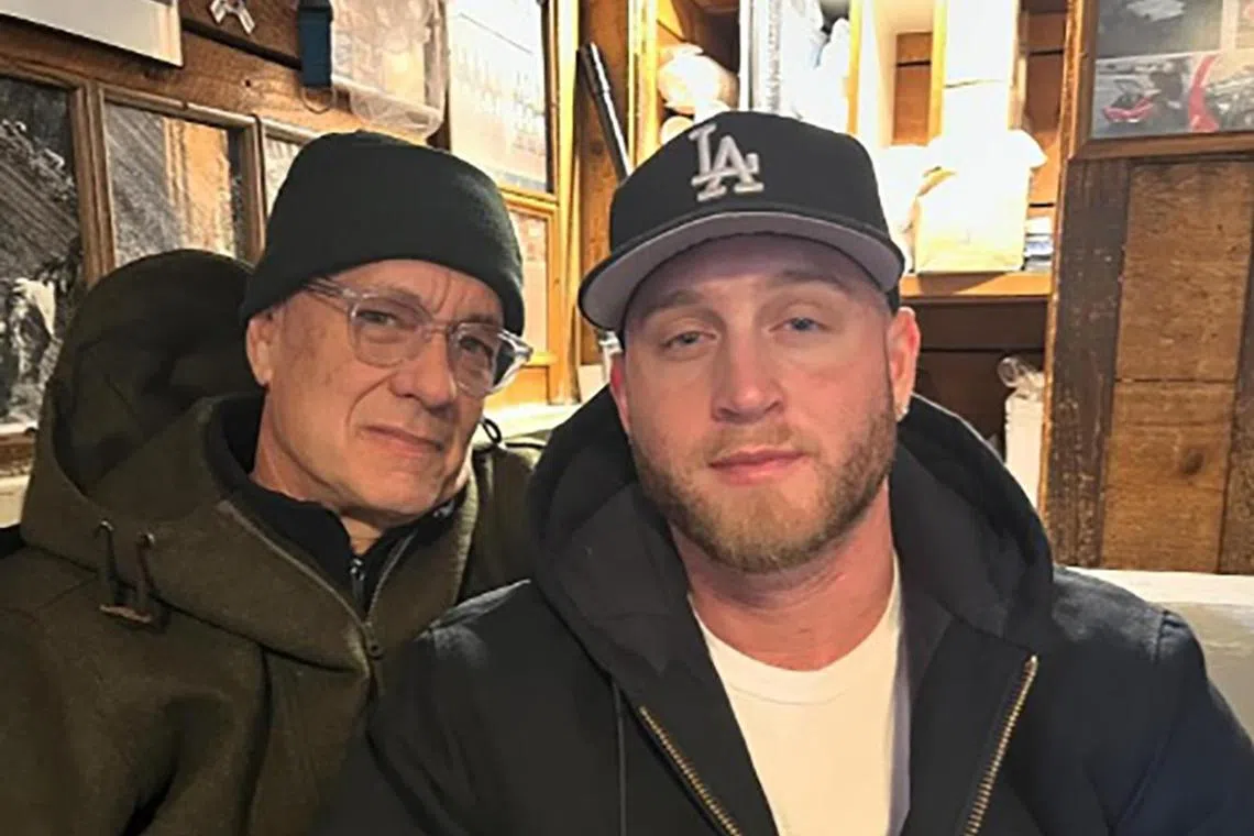 Singer-actor Chet Hanks (right) with his famous father, actor Tom Hanks.