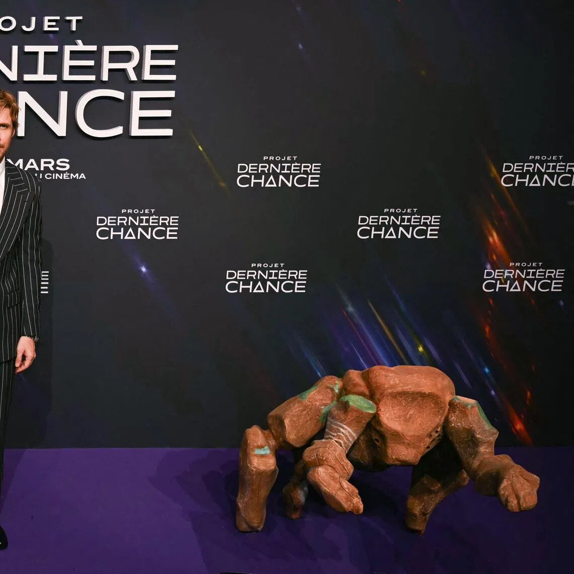 Actor Ryan Gosling with a puppet of Rocky at the photocall of Project Hail Mary in Paris, France on March 11, 2026. 