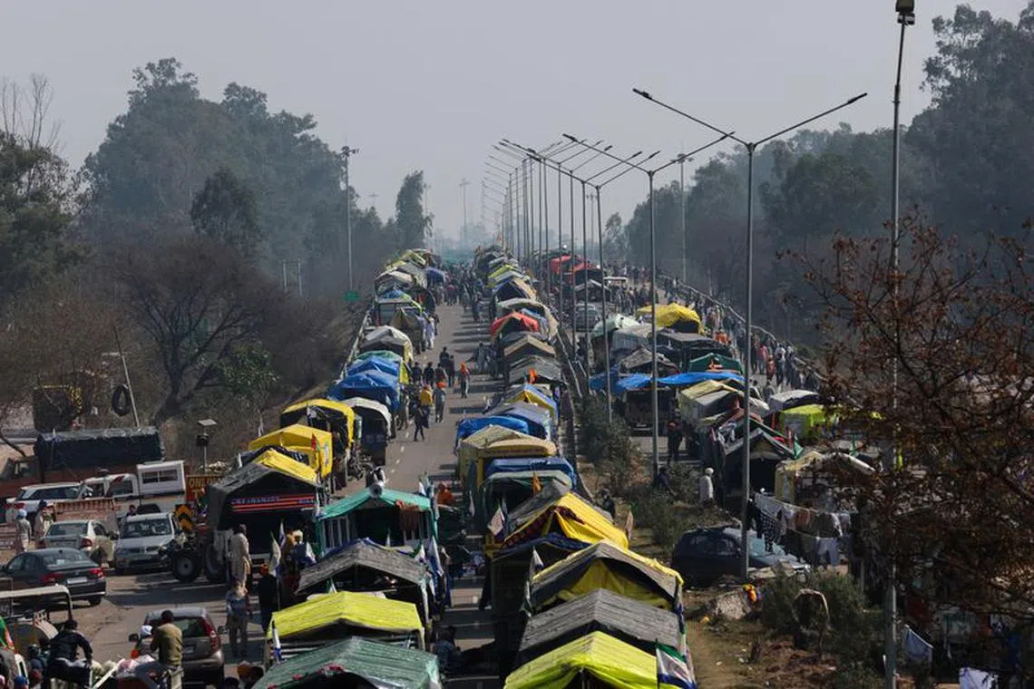Trolleys belonging to farmers, who are marching towards New Delhi to press for better crop prices promised to them in 2021, are parked on a national highway at Shambhu, a border crossing between Punjab and Haryana states, India, February 15, 2024. REUTERS/Anushree Fadnavis