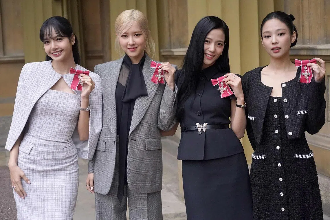 K-Pop band Blackpink's members, Lalisa Manoban, Roseanne Park, Jisoo Kim and Jennie Kim pose with their medals following a special investiture ceremony to present them with Honorary MBEs (Member of the Order of the British Empire), at Buckingham Palace in London on Nov 22, 2023.