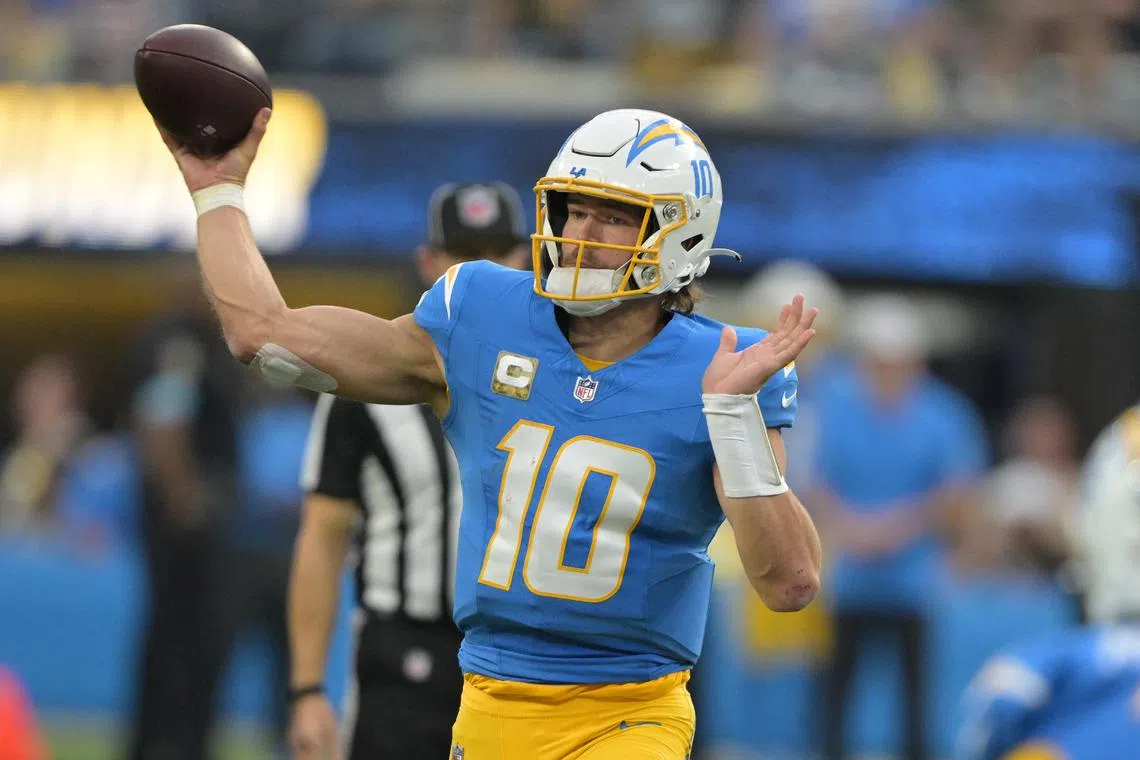 FILE PHOTO: Nov 10, 2024; Inglewood, California, USA;  Los Angeles Chargers quarterback Justin Herbert (10) throws a pass in the second half against the Tennessee Titans at SoFi Stadium. Mandatory Credit: Jayne Kamin-Oncea-Imagn Images/File Photo