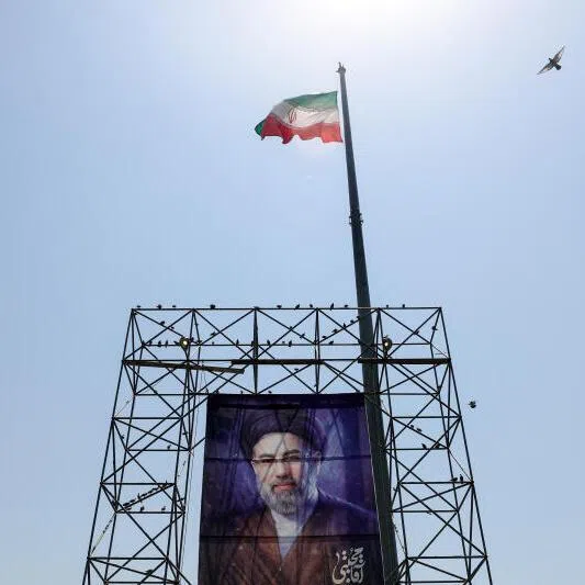 An Iranian flag flying above a poster of Iran’s Supreme Leader Mojtaba Khamenei, in Tehran. Observers say the Trump administration faces an uphill battle to permanently lift Iran sanctions.