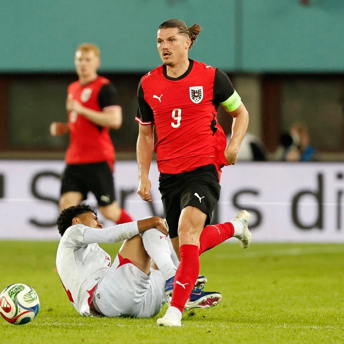 Soccer Football - International Friendly - Austria v Tunisia - Ernst Happel Stadion, Vienna, Austria - June 1, 2026 Austria's Marcel Sabitzer in action with Tunisia's Khalil Ayari REUTERS/Lisa Leutner