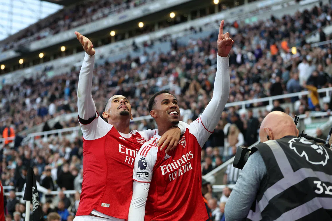 Soccer Football - Premier League - Newcastle United v Arsenal - St James' Park, Newcastle, Britain - September 28, 2025 Arsenal's Gabriel Magalhaes celebrates scoring their second goal with William Saliba REUTERS/Scott Heppell