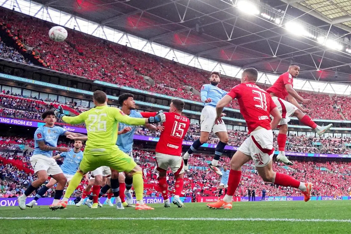 Manchester City's Josko Gvardiol scores their second goal. 