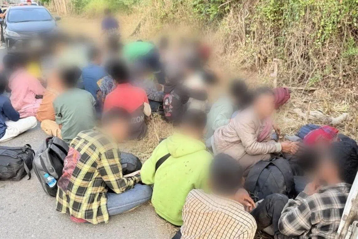 Truck carrying migrant workers crashes while fleeing Thai police; at least 20 injured