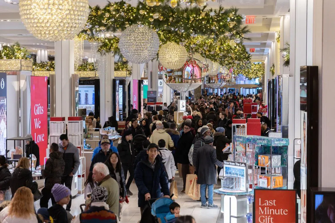 Shoppers walk around at Macy's store in Herald Square on December 23, 2023 in New York City.  