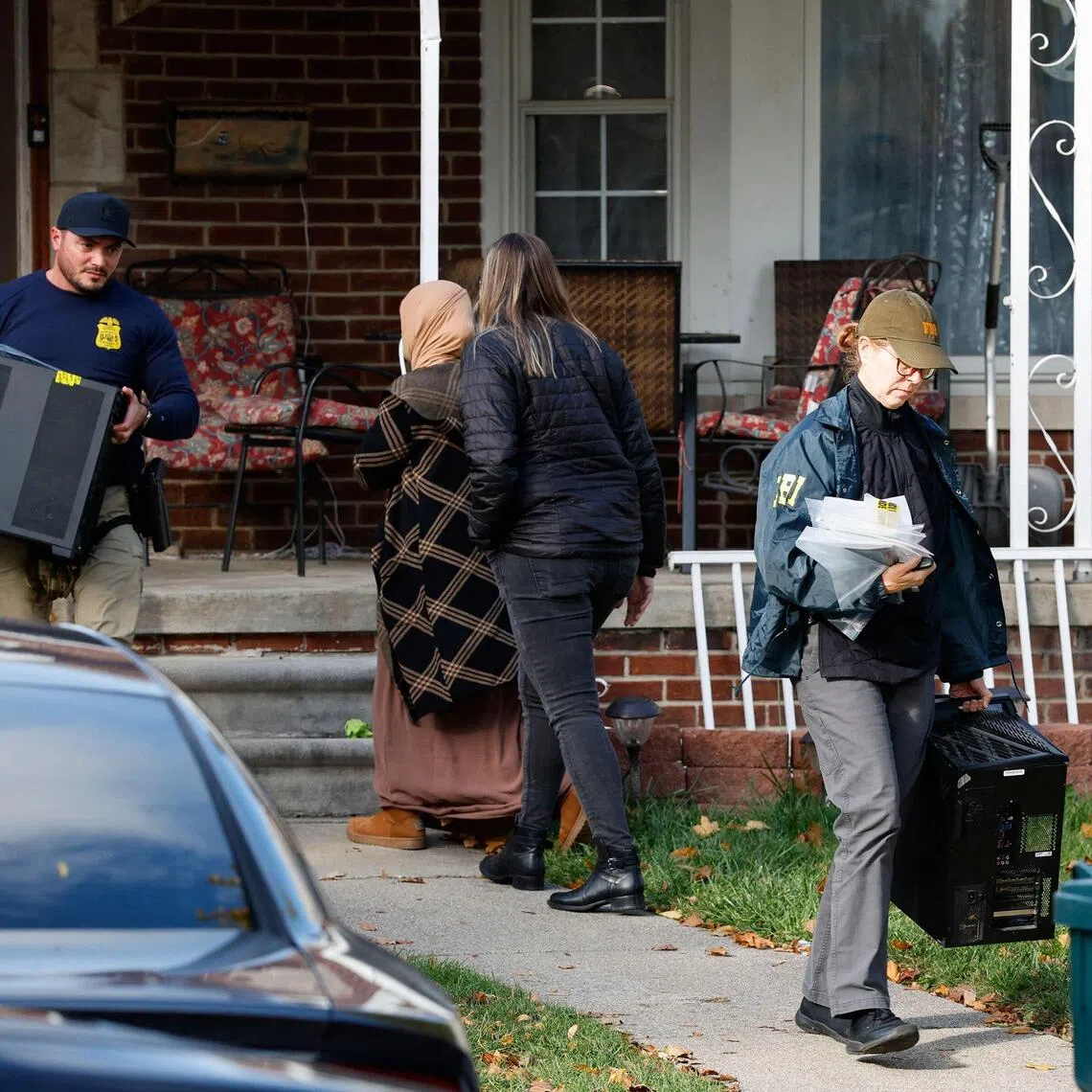 Members of the FBI removing items from a home in Dearborn, Michigan, on Oct 31.
