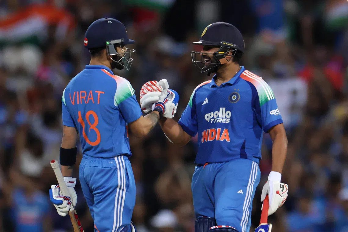 Cricket - One Day International - Australia v India - Sydney Cricket Ground, Sydney, Australia  - October 25, 2025 India's Rohit Sharma and Virat Kohli celebrate after winning the match. REUTERS/Hollie Adams