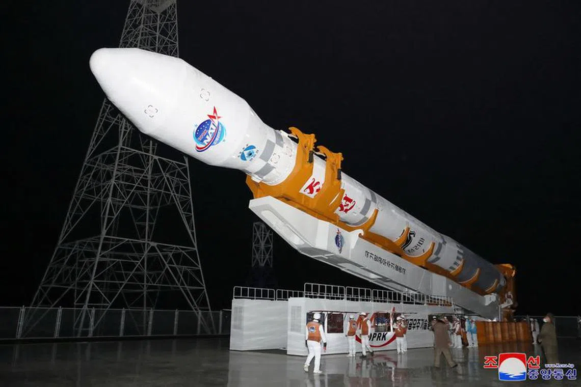 A rocket carrying a spy satellite Malligyong-1 is prepared to be launched, as North Korean government claims, in a location given as North Gyeongsang Province, North Korea in this handout picture obtained by Reuters on November 21, 2023.  KCNA via REUTERS