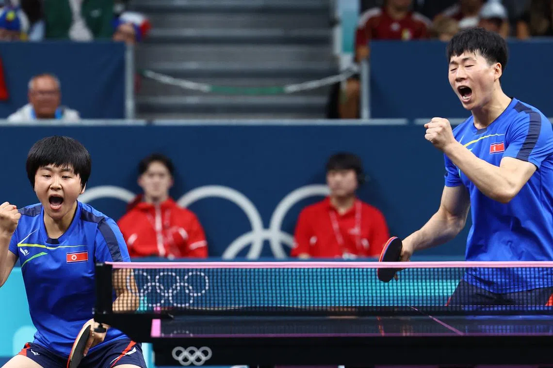 Paris 2024 Olympics - Table Tennis - Mixed Doubles Round of 16 - South Paris Arena 4, Paris, France - July 27, 2024. Jong Sik Ri of North Korea and Kum Yong Kim of North Korea react during their round of 16 match against Tomokazu Harimoto of Japan and Hina Hayata of Japan. REUTERS/Stephanie Lecocq