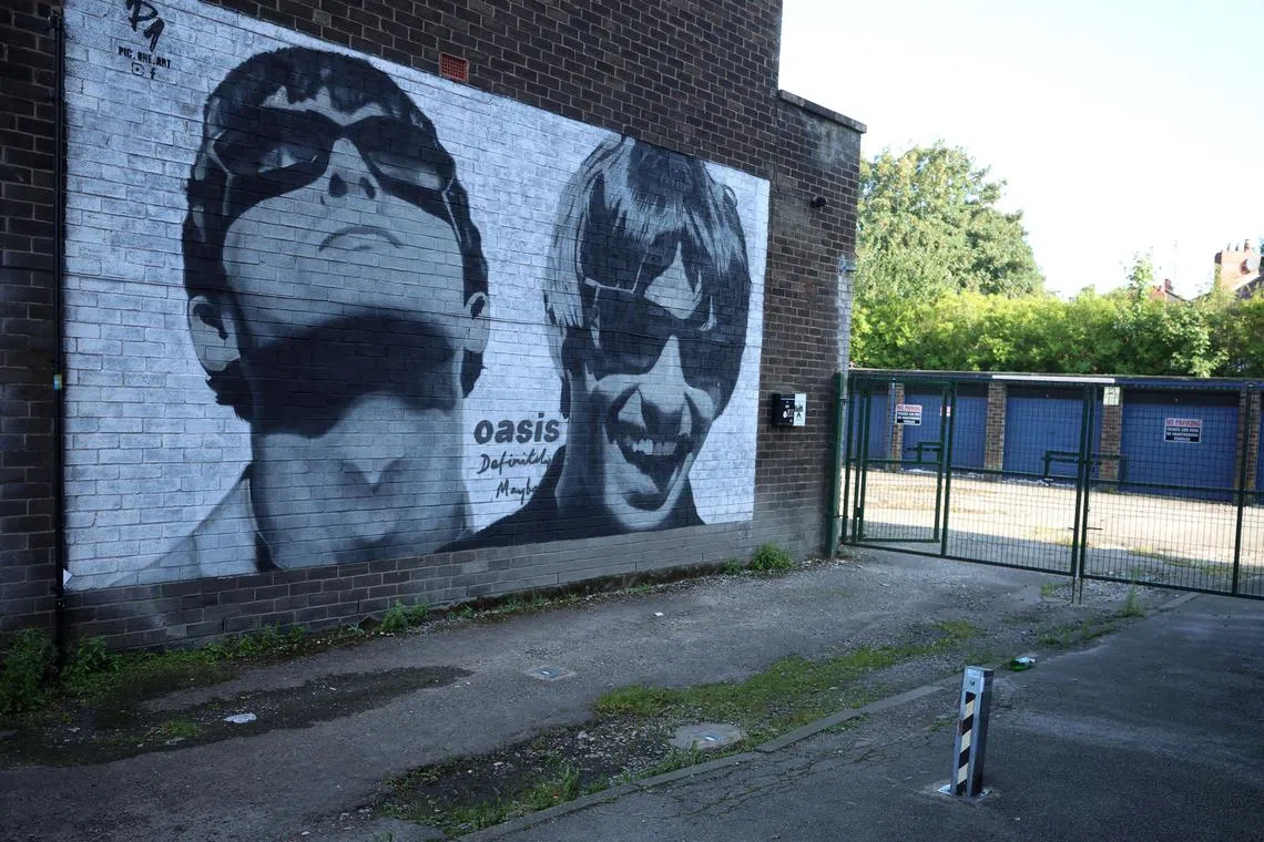 FILE PHOTO: A view of a mural of Oasis band members Liam and Noel Gallagher by artist Pic.One.Art on the side of Sifters record shop in the Burnage area of Manchester, Britain, August 31, 2024. REUTERS/Phil Noble/File Photo