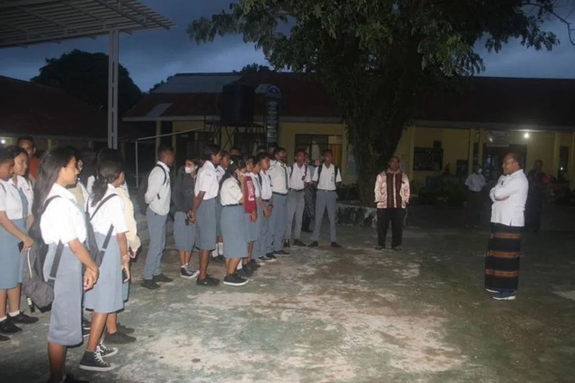 Students arriving at 5am to start lessons early at a senior high school in Kupang, Indonesia. 