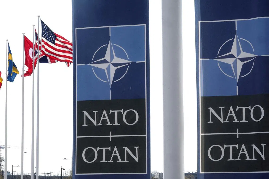 FILE PHOTO: National flags of Alliance's members flutter at NATO headquarters in Brussels, Belgium April 2, 2025. REUTERS/Yves Herman/File Photo