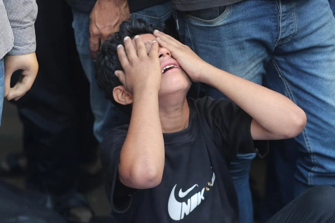 A boy mourns during the funeral of Palestinians killed in overnight Israeli strikes, according to medics, at Al-Shifa Hospital in Gaza City, September 1, 2025. REUTERS/Mahmoud Issa