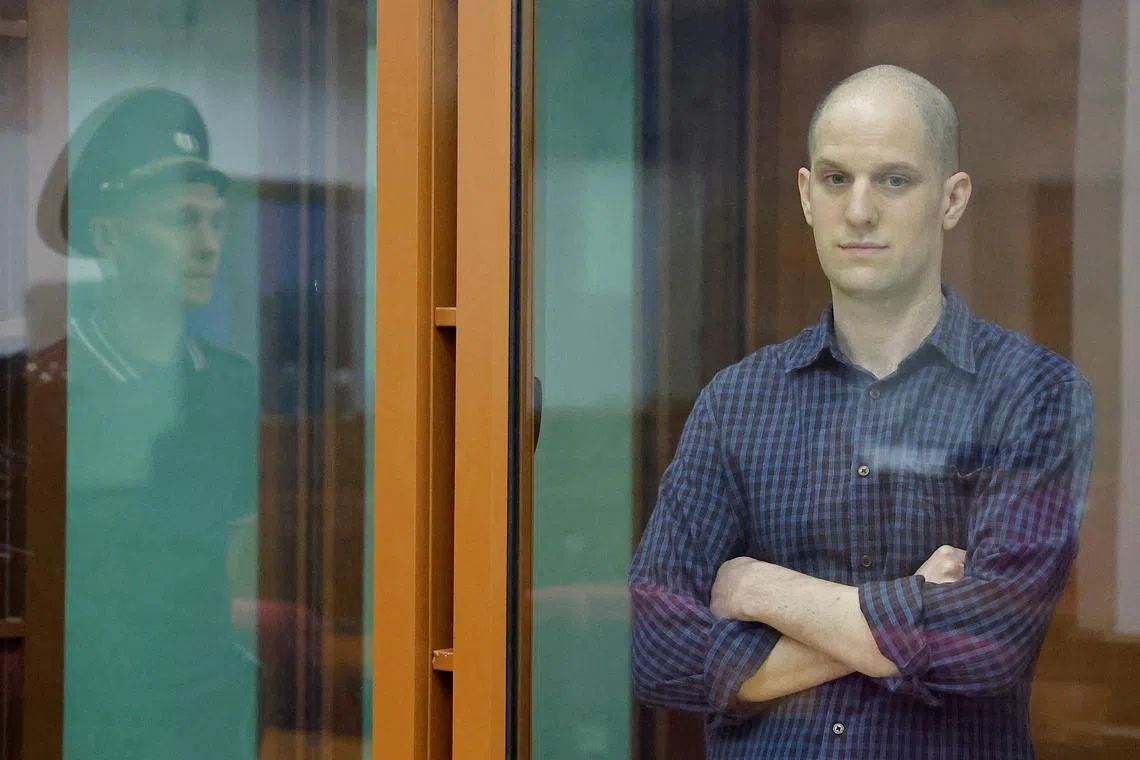 Wall Street Journal reporter Evan Gershkovich, who stands trial on spying charges, is seen inside an enclosure for defendants before a court hearing in Yekaterinburg, Russia June 26, 2024. REUTERS/Evgenia Novozhenina