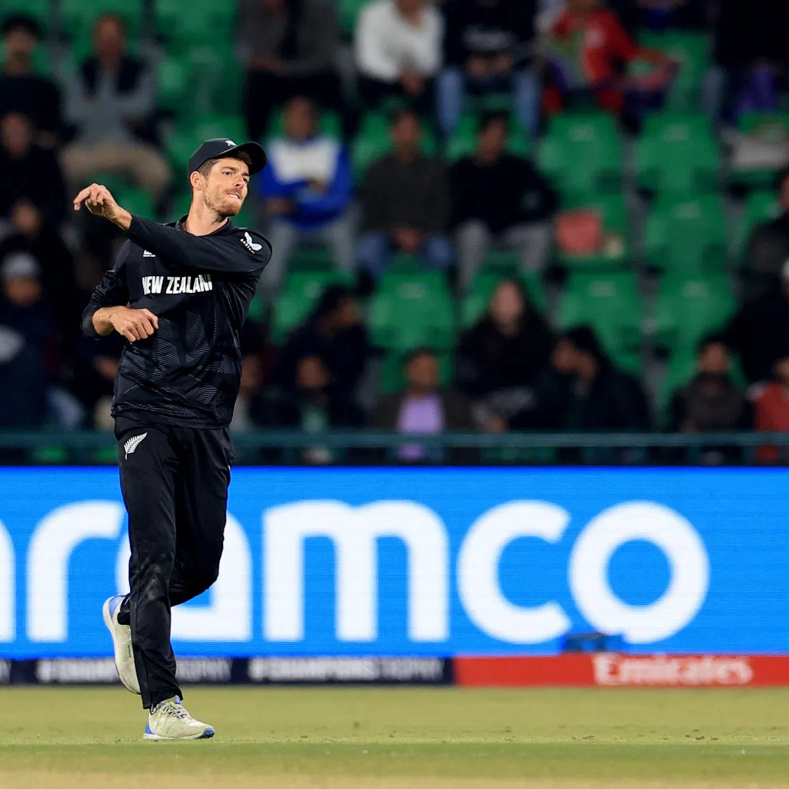 FILE PHOTO: Cricket - ICC Men's Champions Trophy - Semi Final - South Africa v New Zealand - Gaddafi Stadium, Lahore, Pakistan - March 5, 2025 New Zealand's Mitchell Santner in action fielding REUTERS/Akhtar Soomro/ File Photo