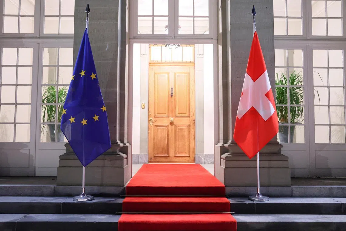 FILE PHOTO: Swiss and European Union flags hang at the Lohn Estate in Kehrsatz near Bern, Switzerland, November 27, 2024. REUTERS/Denis Balibouse/File Photo