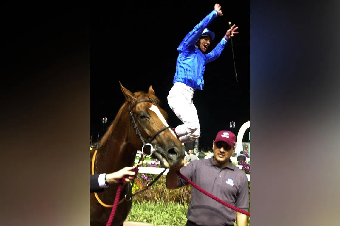 Frankie Dettori leaping off Grandera after their win in the Group 1 Singapore Airlines International Cup (2,000m) at Kranji in 2002.