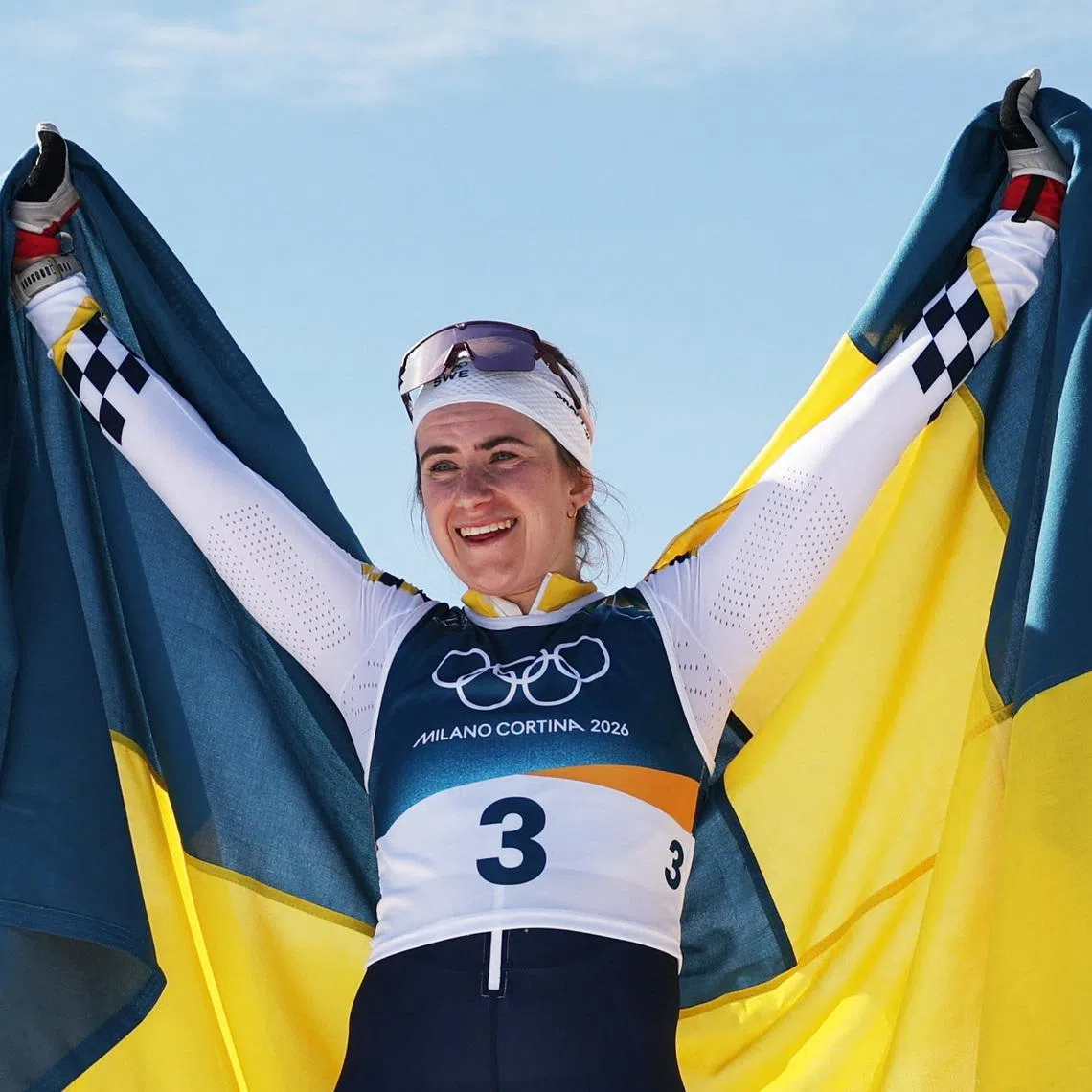 Milano Cortina 2026 Olympics - Cross-Country Skiing - Women's 50km Mass Start Classic - Tesero Cross-Country Skiing Stadium, Lago, Italy - February 22, 2026. Ebba Andersson of Sweden celebrates after crossing the finish line to win gold in the Women's 50km Mass Start Classic REUTERS/Kai Pfaffenbach