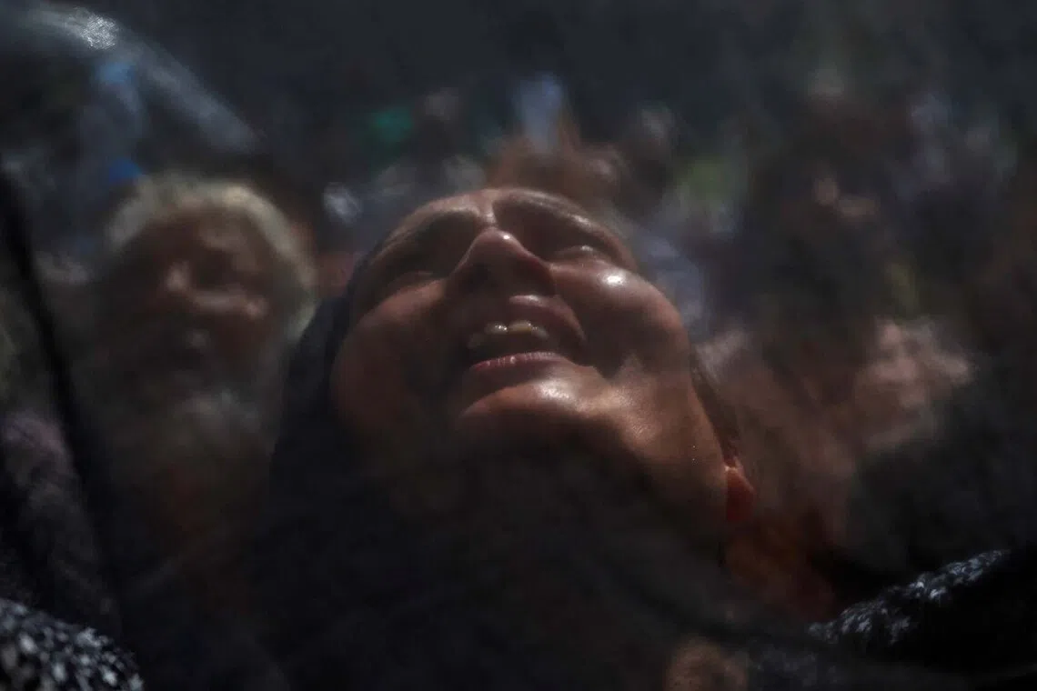A Kashmiri Muslim woman reacts upon seeing a relic believed to be a hair from the beard of the Prophet Mohammad, displayed during the festival of Eid-e-Milad-ul-Nabi, the birth anniversary of the prophet, at Hazratbal Shrine in Srinagar, Indian Kashmir, August 26, 2026. REUTERS/Sharafat Ali TPX IMAGES OF THE DAY