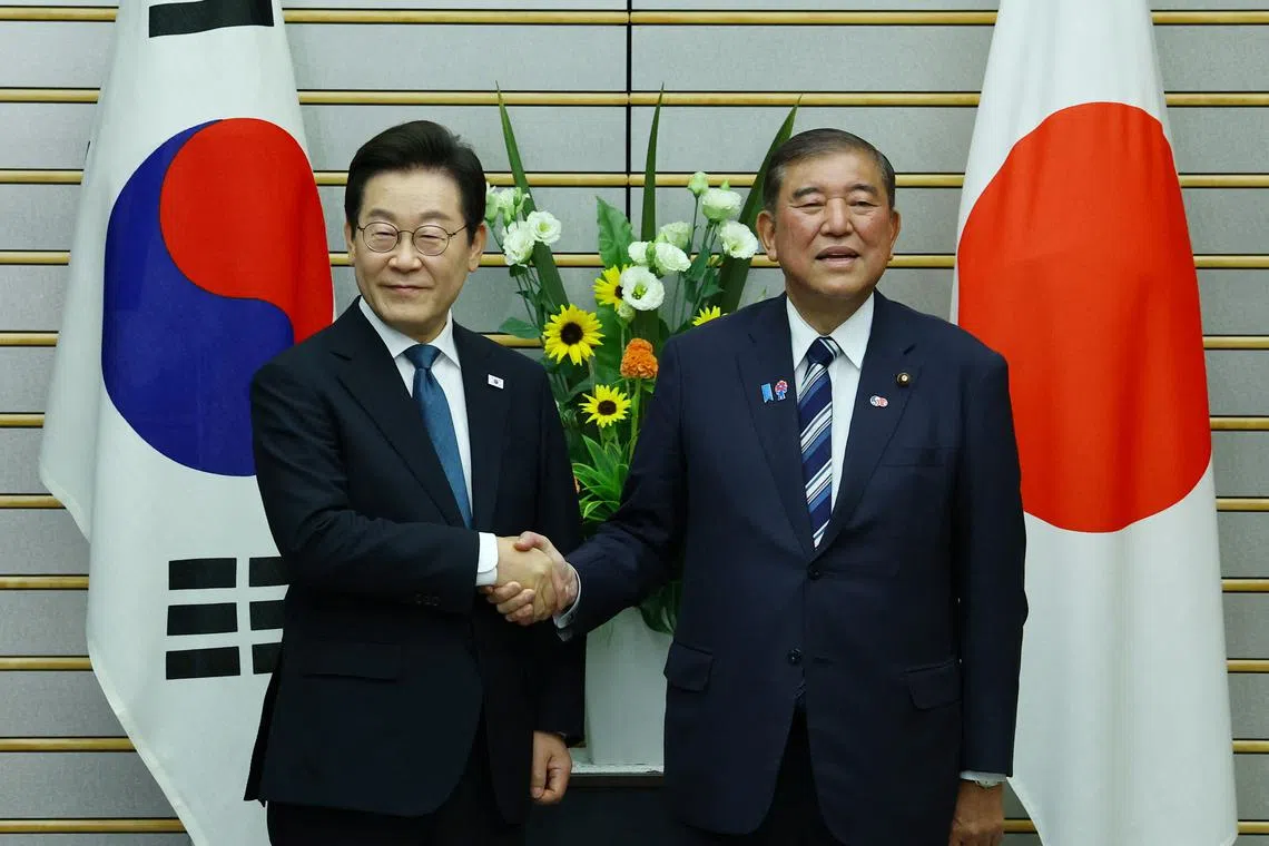 South Korean President Lee Jae-myung (left) meeting Japanese Prime Minister Shigeru Ishiba in Tokyo on Aug 23.