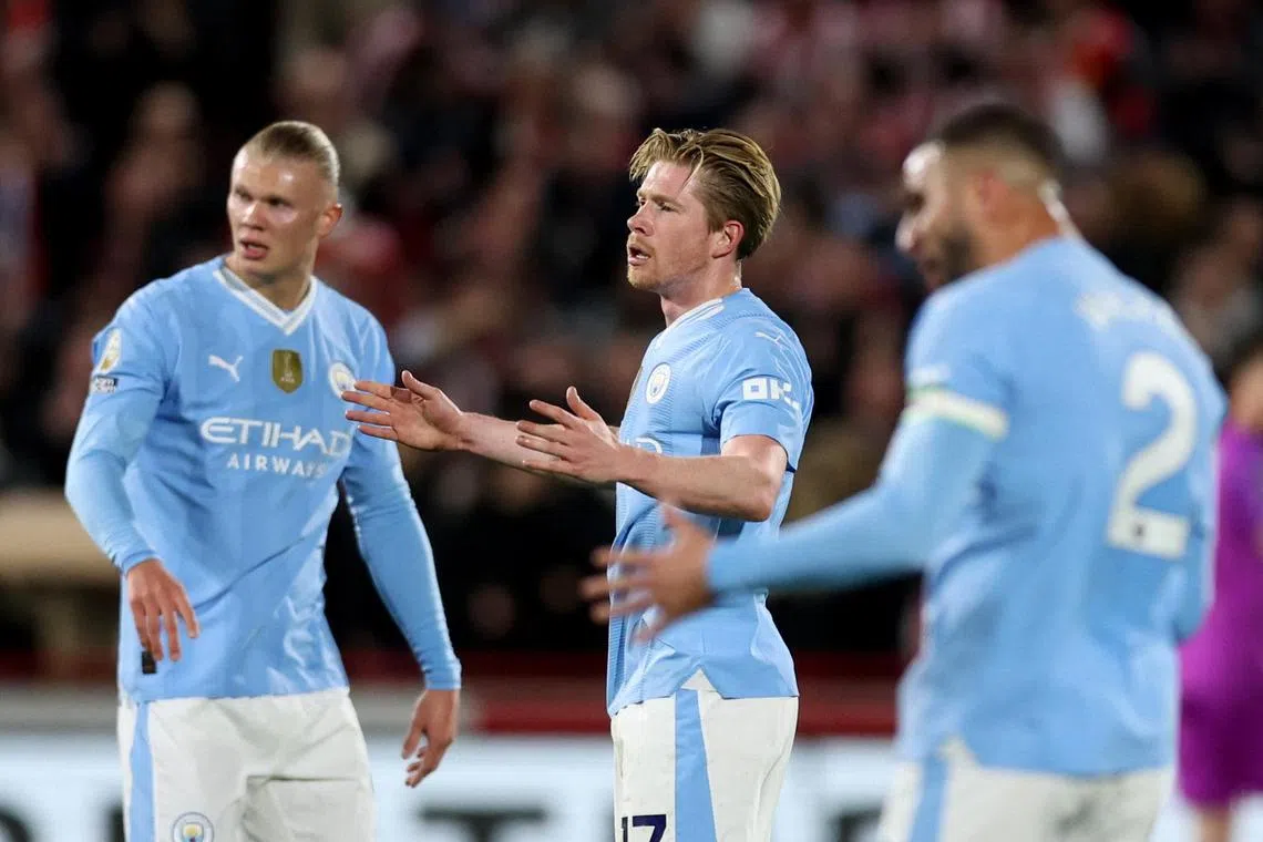 Manchester City's Erling Haaland (left) and Kevin De Bruyne (centre) react during City's match against Brentford.