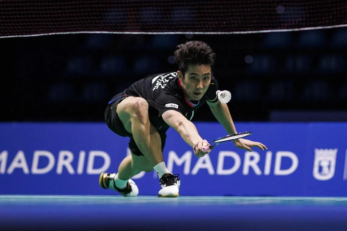 epa11248183 Loh Kean Yew of Singapore in action against Christo Popov of France during their Madrid Masters Badminton men's singles round of 16 match at the Gallur sports center in Madrid, Spain, 28 March 2024.  EPA-EFE/Rodrigo Jimenez