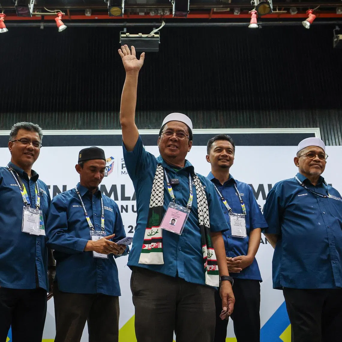 Mr Abidin Ismail (centre) from Parti Islam SeMalaysia, a member of the PN alliance, won the Sungai Bakap seat with about 58.6 per cent of the valid votes.