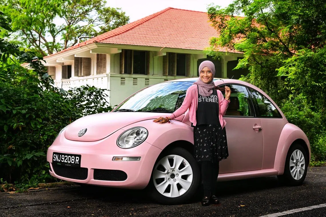 Dr Iman Nasyita Mohtar and her pink Volkswagen Beetle on July 4, 2023. 