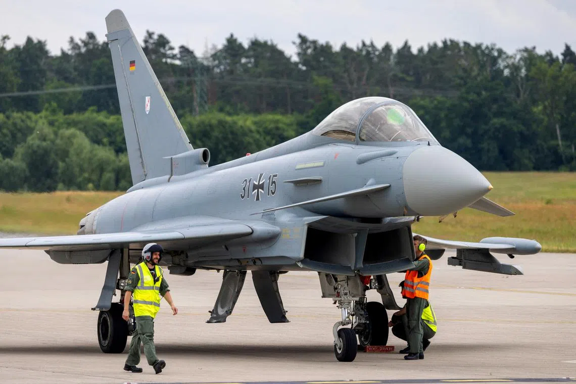 FILE PHOTO: An Eurofighter parks on the tarmac after a flight demonstration during the International Aerospace Exhibition ILA on the opening day at Schoenefeld Airport in Berlin, Germany June 5, 2024. REUTERS/Axel Schmidt/File Photo