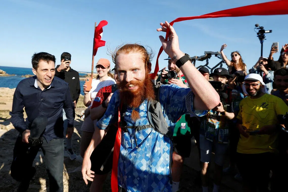 Britain's Russ Cook becomes the first person to run the entire length of Africa on April 7, 2024., nearly a year after he set off.