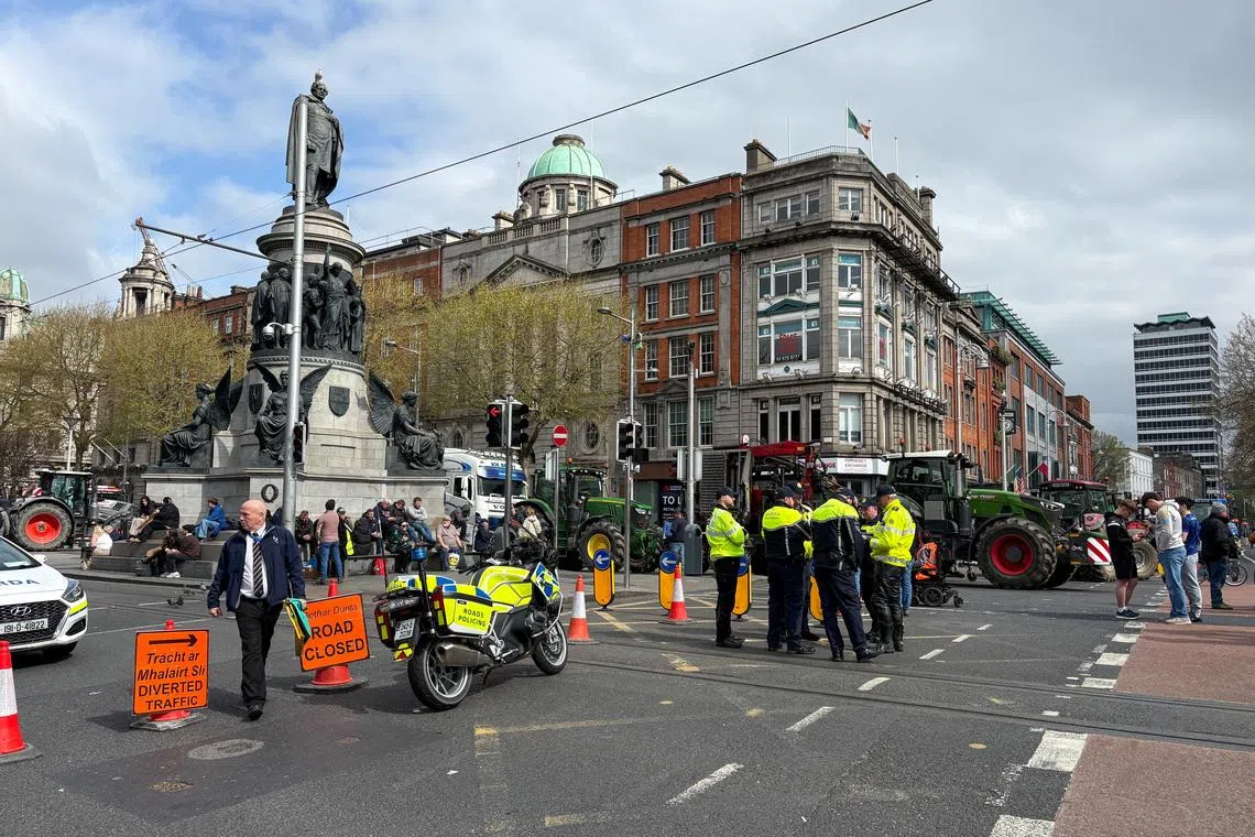 Police officers stand in the street, as tractors block Dublin's O'Connell Street, as part of a protest over the high cost of fuel that clogged up busy thoroughfares and motorways across Ireland for a second successive day, in Dublin, Ireland April 8, 2026. Conor Humphries/REUTERS/File Photo