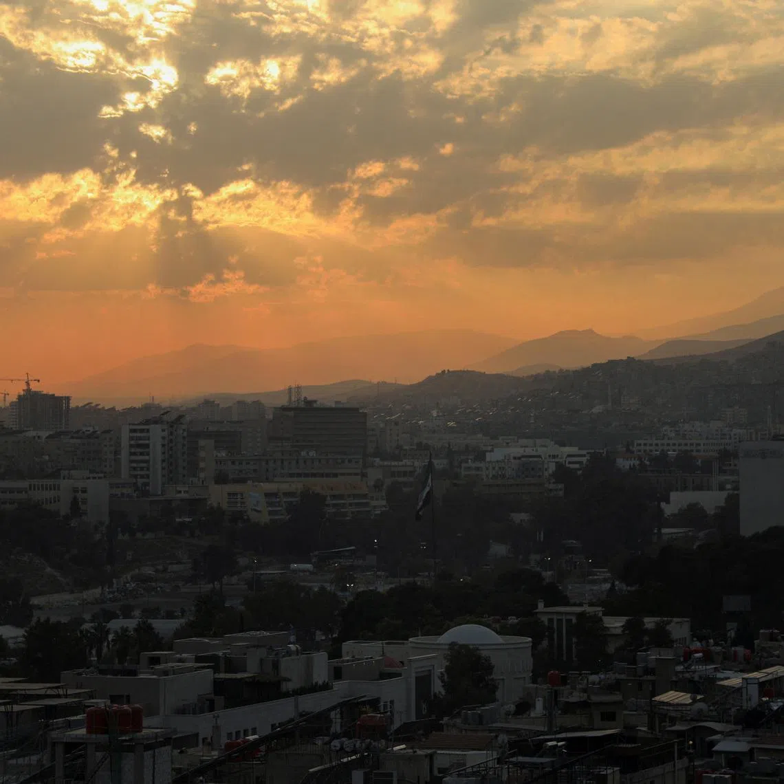 The sun sets over the skyline of Damascus, Syria, November 18, 2025. REUTERS/Orhan Qereman