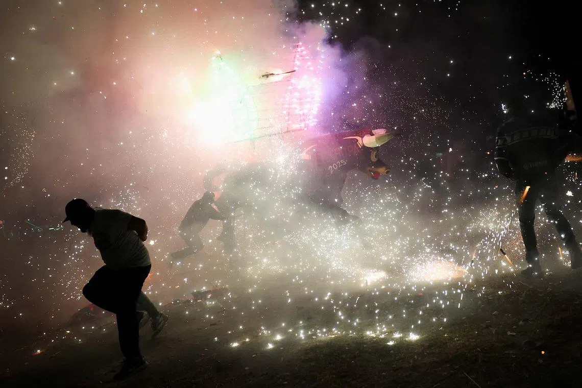 Fireworks exploding from a traditional bull figure known as El Torito during the annual San Juan de Dios celebrations in Tultepec, Mexico, March 8, 2025. 