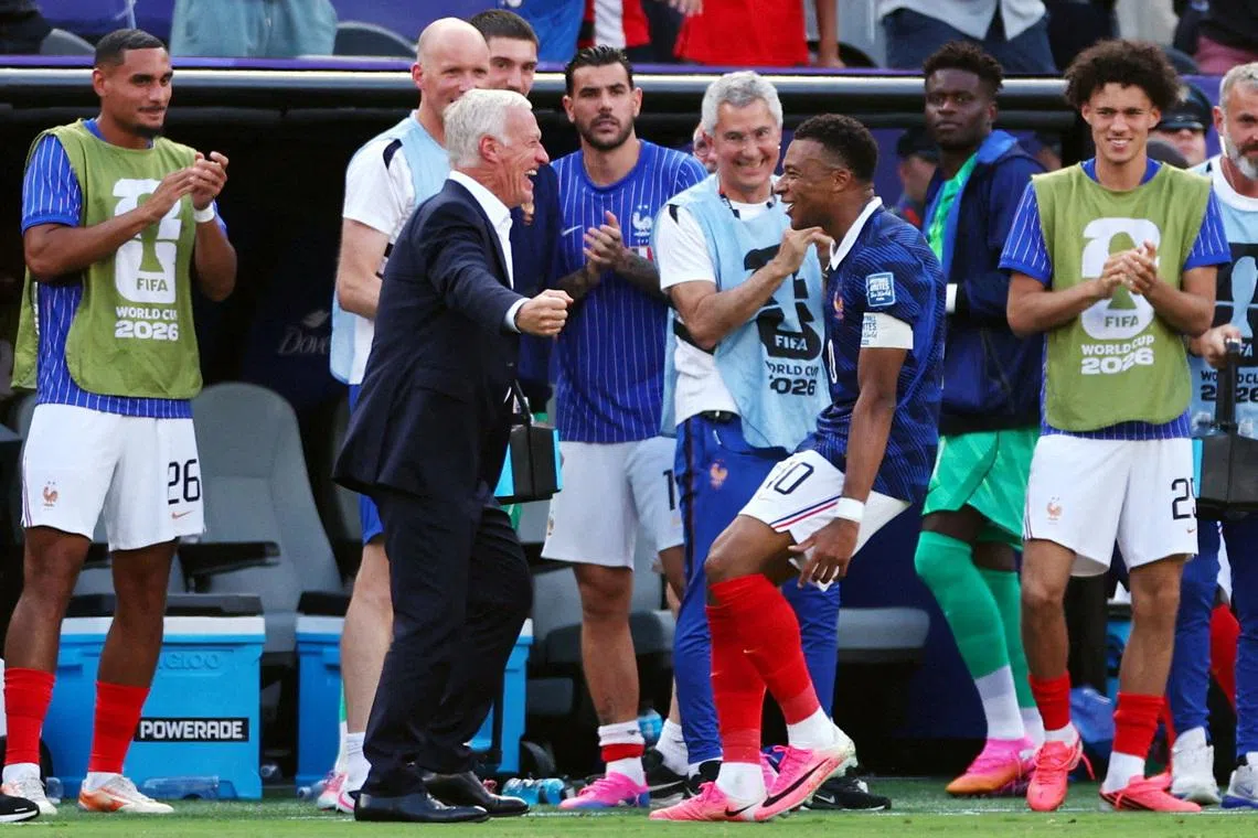 Soccer Football - FIFA World Cup 2026 - Round of 32 - France v Sweden - New York New Jersey Stadium, East Rutherford, New Jersey, U.S. - June 30, 2026 France's Kylian Mbappe celebrates scoring their first goal with coach Didier Deschamps IMAGN IMAGES via Reuters/Vincent Carchietta