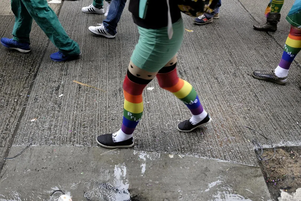 FILE PHOTO: People take part in the annual LGBT pride parade in Hong Kong, China November 26, 2016. REUTERS/Bobby Yip/File Photo