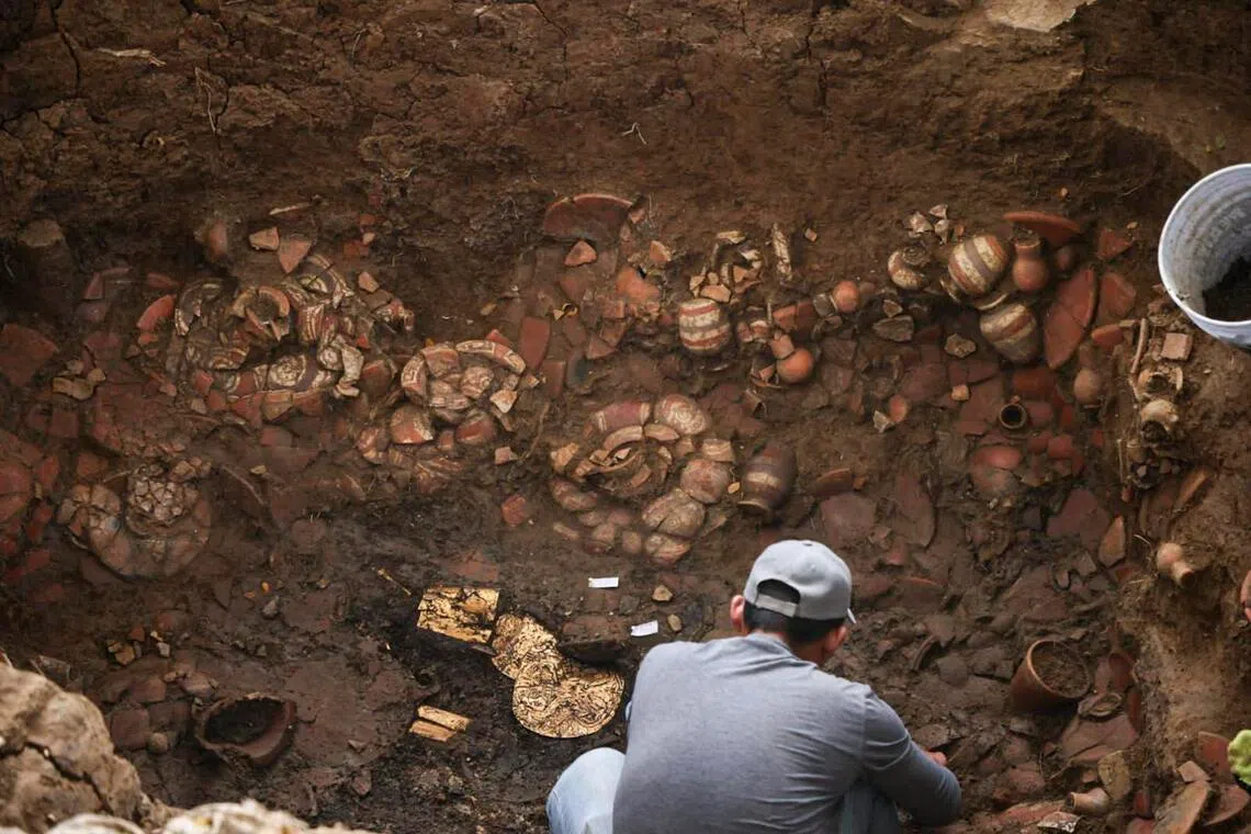 This handout picture released by Panama’s Ministry of Culture shows an archaeologist working inside a pre-Hispanic tomb approximately 1,200 years old, discovered at the El Cano Archaeological Park in Cocle, Panama, on Feb 20, 2026.