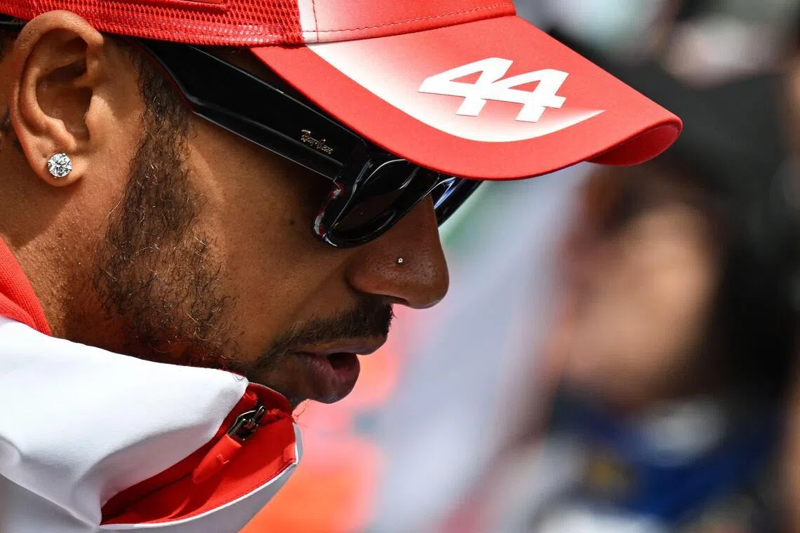 Ferrari's British driver Lewis Hamilton reacts as he takes part in the drivers parade ahead of the Formula One Belgian Grand Prix at the Spa-Francorchamps circuit, in Spa, on July 19, 2026.