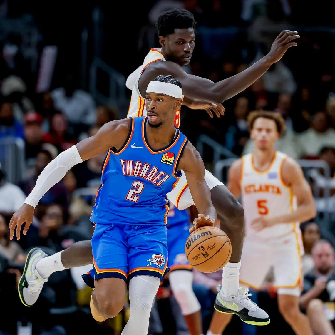 Oklahoma City Thunder guard Shai Gilgeous-Alexander leaving Atlanta Hawks forward Mouhamed Gueye in his wake during the their NBA game in Atlanta on Oct 25. 