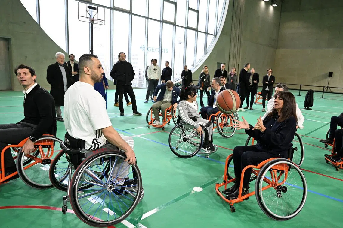 Mayor of Paris Anne Hidalgo participates in a wheelchair basketball exhibition game during the inauguration of the Arena Porte de La Chapelle ahead of the Olympics 2024, in Paris, France February 11, 2024.     MIGUEL MEDINA/Pool via REUTERS/ File photo