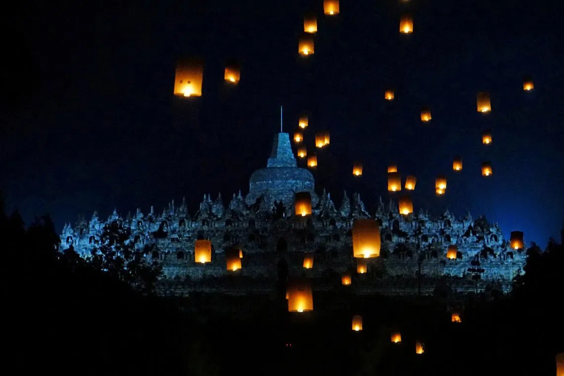 Paper lanterns are seen flying near Borobudur temple during the festival to mark the Vesak Day celebration in Magelang, Central Java province, Indonesia, on June 4, 2023.