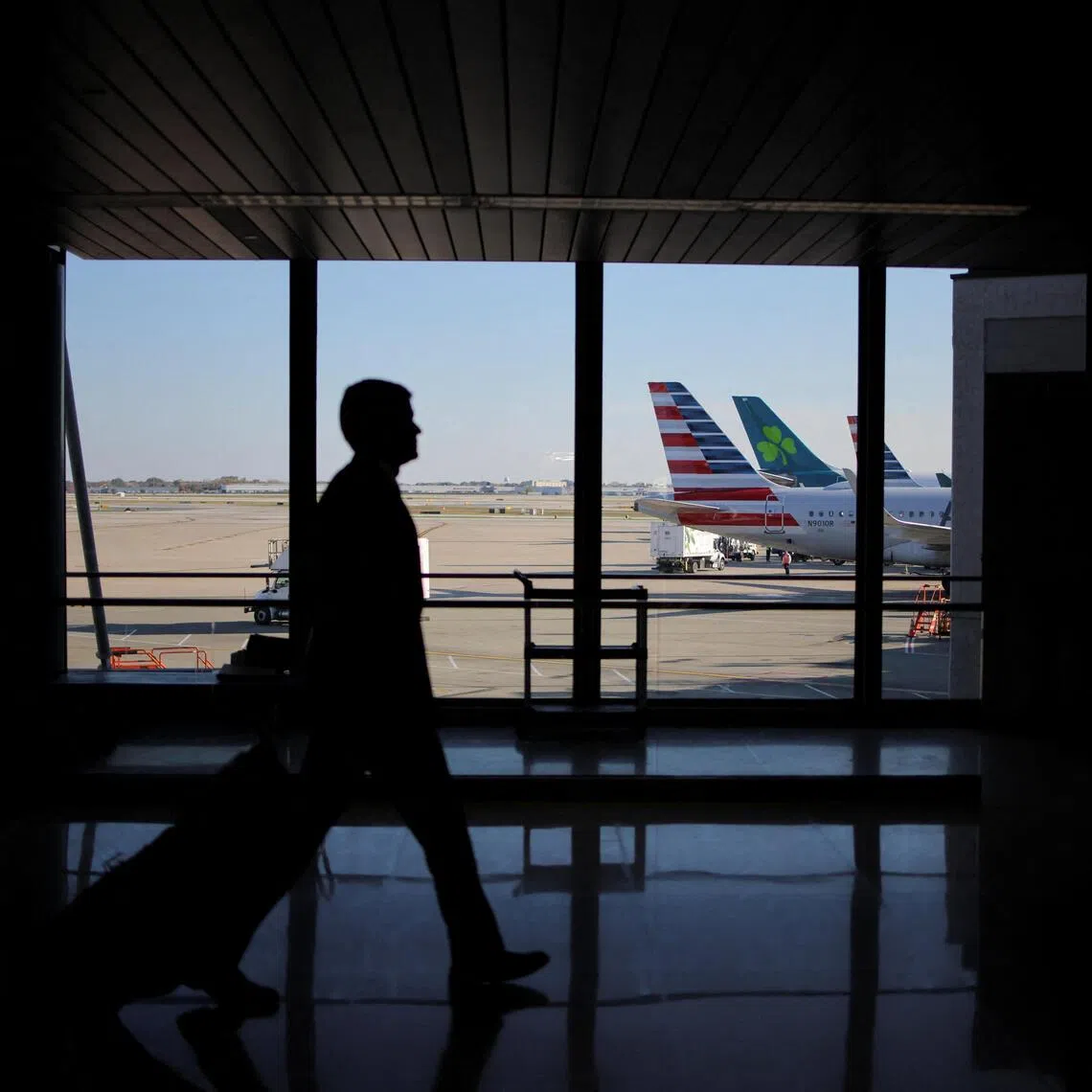 A traveller walks through Chicago O'Hare International Airport as the US. government shutdown continues.