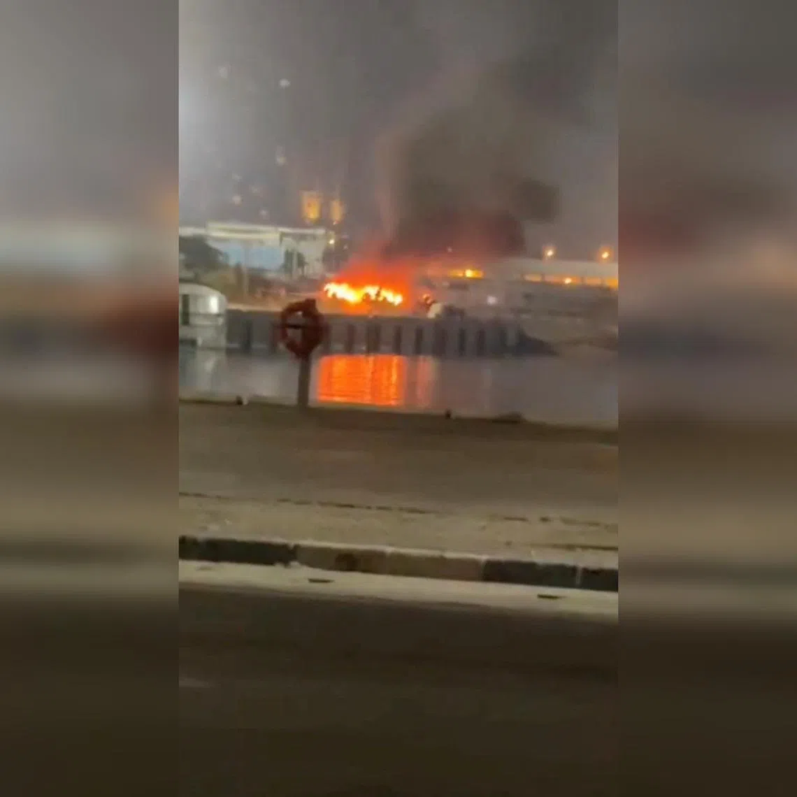 A fire burning at the port of Kish Island in Iran, in a screengrab taken from a social media video released on July 14.