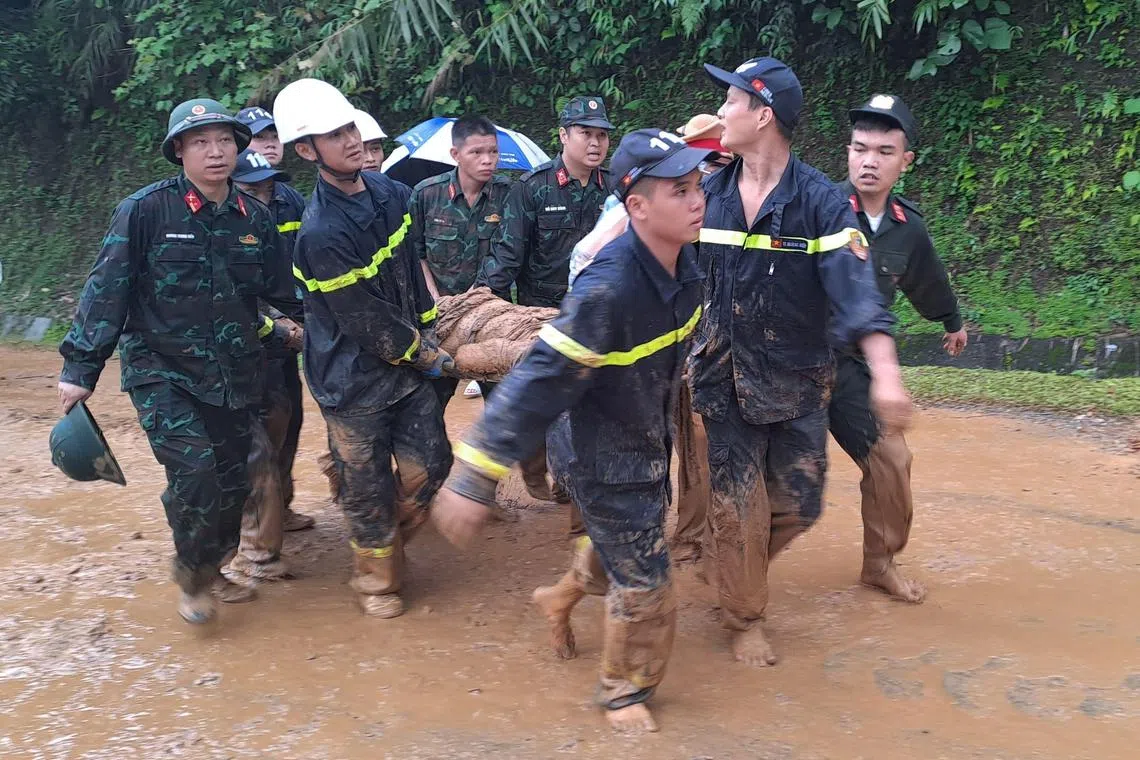 Rescue teams in Ha Giang province found 11 people dead and four injured after a landslide buried a 16-seater van.