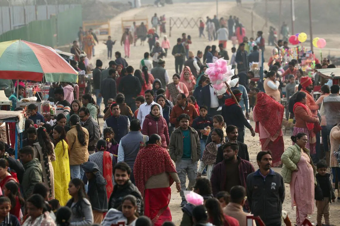 People crowd the eating area outside the Shivalaya park where replicas of twelve Jyotirlinga shrines dedicated to the Hindu deity Shiva have been constructed, ahead of the upcoming Maha Kumbh Mela festival in Prayagraj.