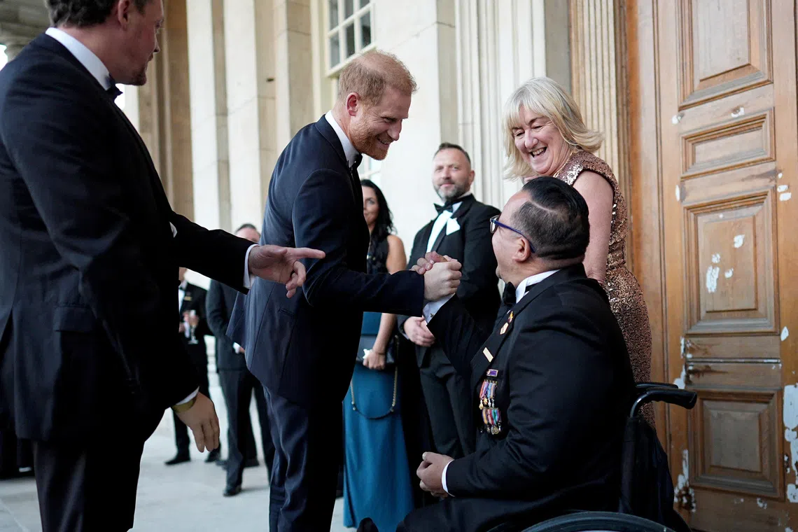 Britain’s Prince Harry, Duke of Sussex, speaks with guests as he arrives at the inaugural Invictus Spirit Awards in London, Britain.