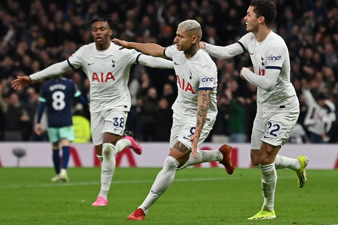 Tottenham Hotspur's Brazilian striker #09 Richarlison (C) celebrates scoring the team's third goal with Tottenham Hotspur's Italian defender #38 Destiny Udogie (L) and Tottenham Hotspur's Welsh striker #22 Brennan Johnson during the English Premier League football match between Tottenham Hotspur and Brentford at the Tottenham Hotspur Stadium in London, on January 31, 2024. (Photo by Glyn KIRK / AFP) / RESTRICTED TO EDITORIAL USE. No use with unauthorized audio, video, data, fixture lists, club/league logos or 'live' services. Online in-match use limited to 120 images. An additional 40 images may be used in extra time. No video emulation. Social media in-match use limited to 120 images. An additional 40 images may be used in extra time. No use in betting publications, games or single club/league/player publications. / 